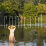 02-09-2004 Patricia Paay at home in Rijkevorsel, Belgium. By order of Pulse Magazine. September 02, 2004. 

[keywords]Posed, Smiling, Lake, Ducks[/keywords]